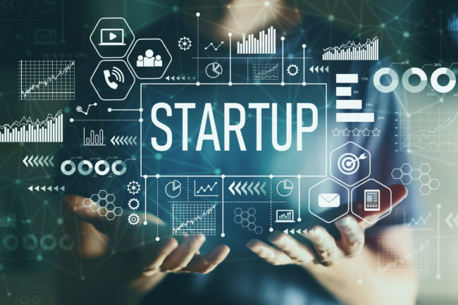 Person holding a start-up graphic